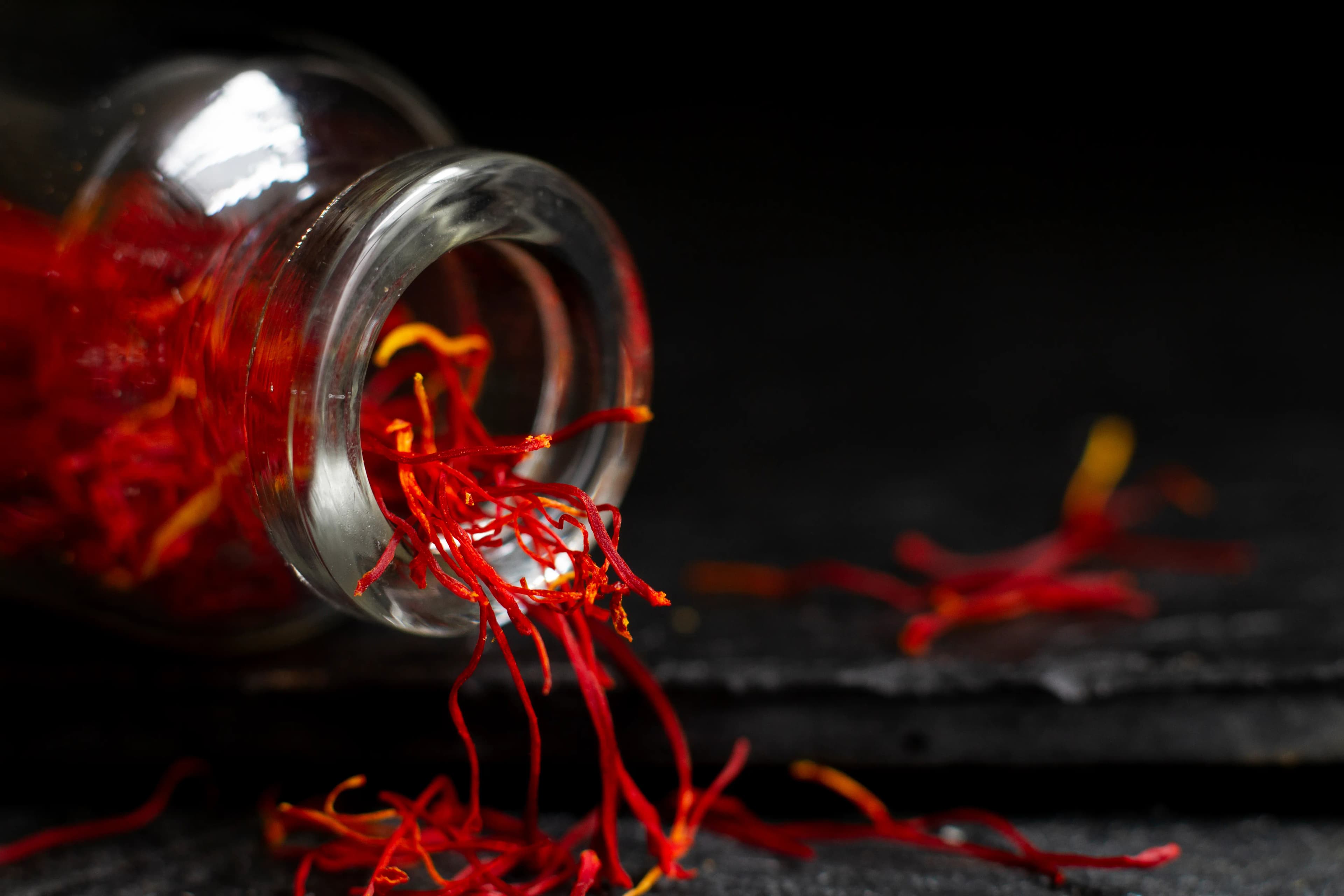 Saffron threads on a dark surface
